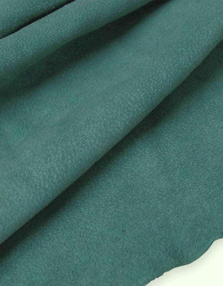 Soft and tactile lightweight suede leather in a muted shade of blue/green teal ideal for garment making, applique, linings
