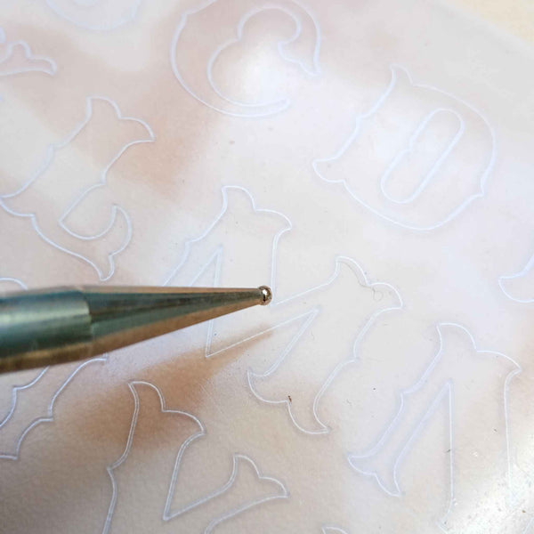 Embossing sheet for transferring patterns to vegetable tanned leather -  alphabet lettering - stylised outlines that can be decorated with score lines, swivel knife cuts and craftools.