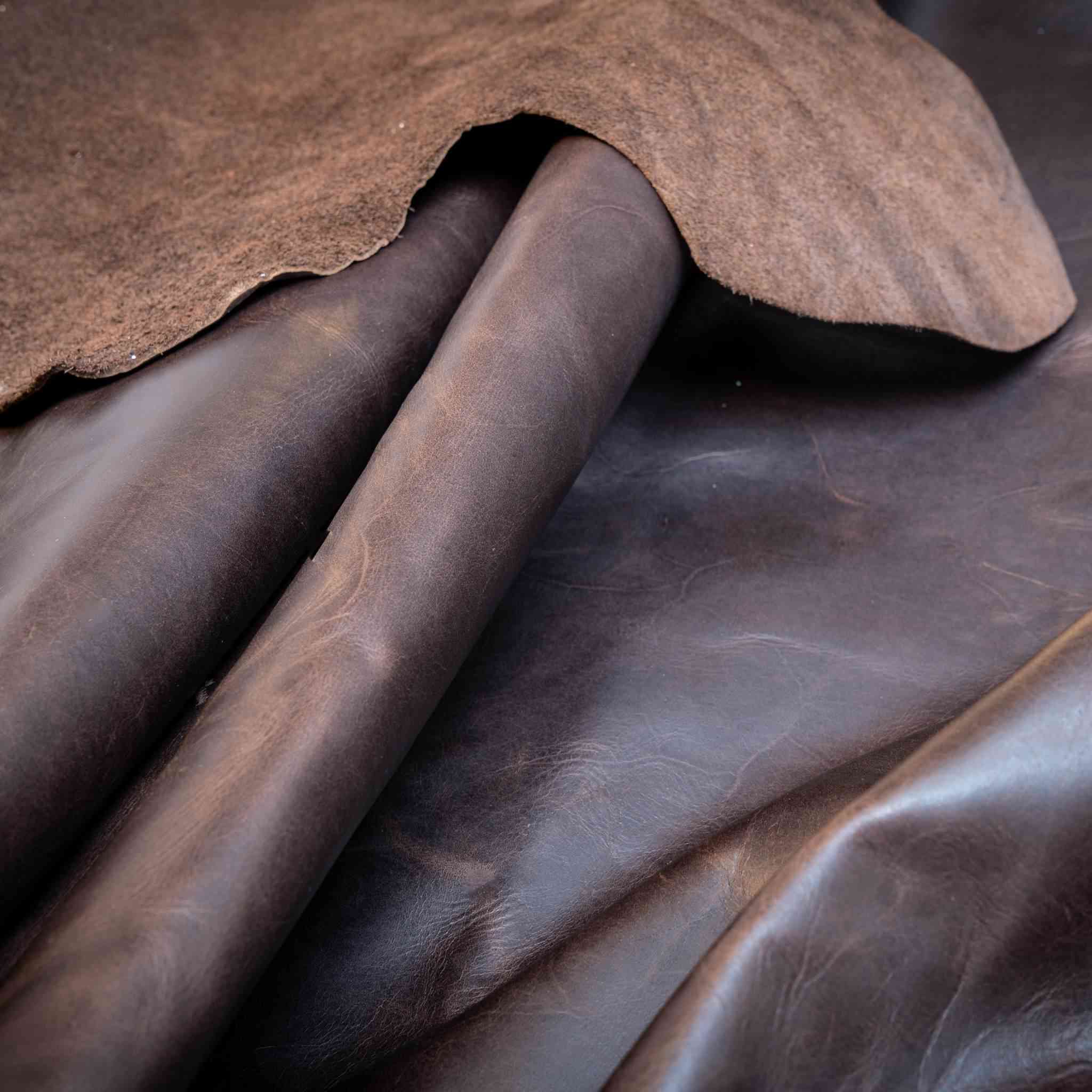 New in Stock  Soft, vintage look cowhide, approx 1.0-1.4mm in Dark Brown  Ideal for upholstery, bag making, waistcoats, jackets, tool rolls, aprons, pouches, Dopp zipped travel bags and more.