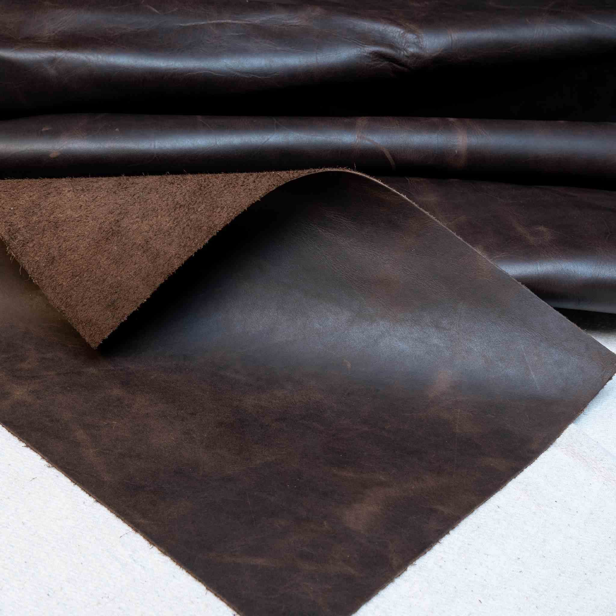 New in Stock  Soft, vintage look cowhide, approx 1.0-1.4mm in Dark Brown  Ideal for upholstery, bag making, waistcoats, jackets, tool rolls, aprons, pouches, Dopp zipped travel bags and more.