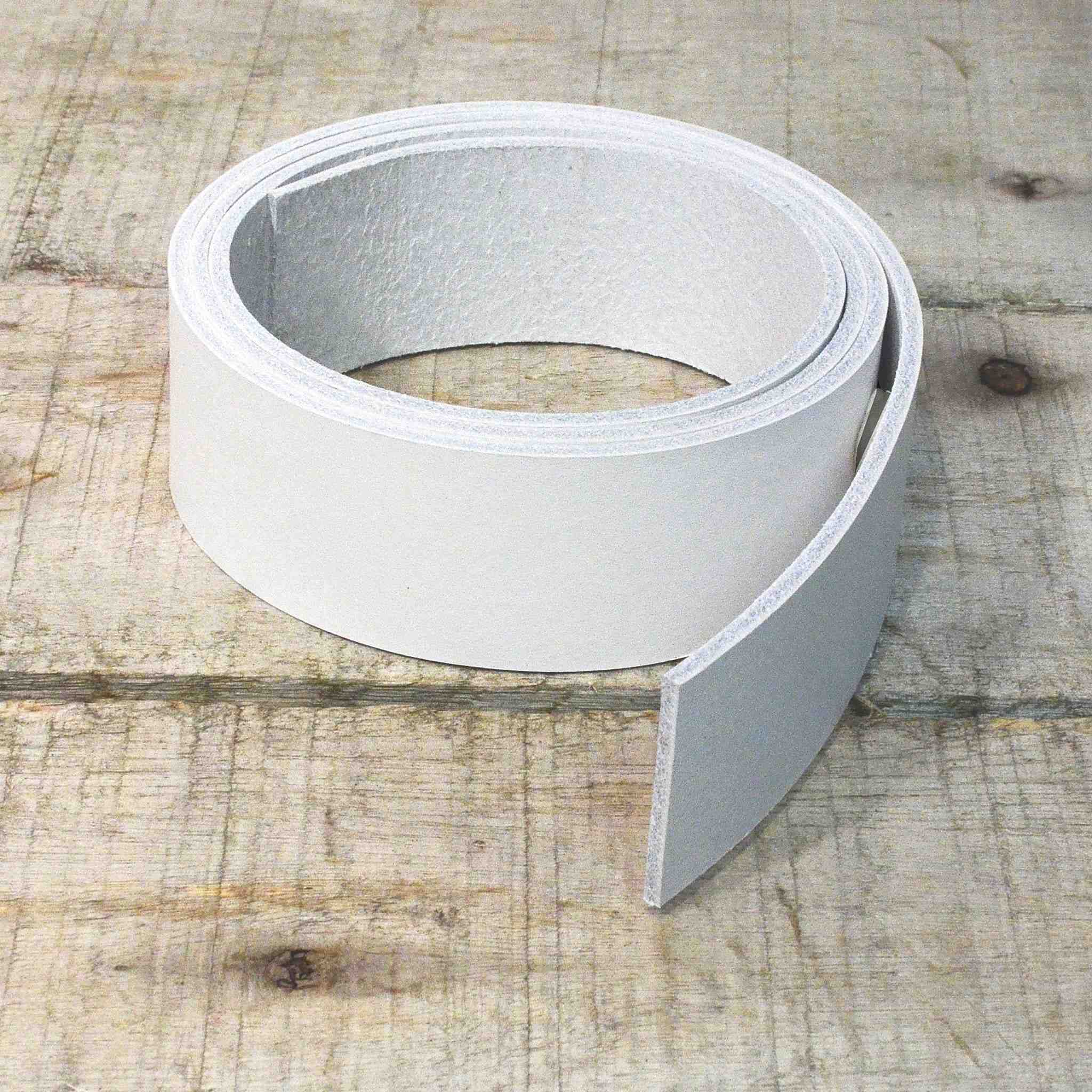 Image showing dyed veg tan leather strip in white.