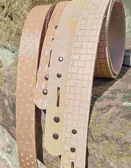 Patterned and embossed leather belt blanks ready for dyeing and colouring and adding the buckle