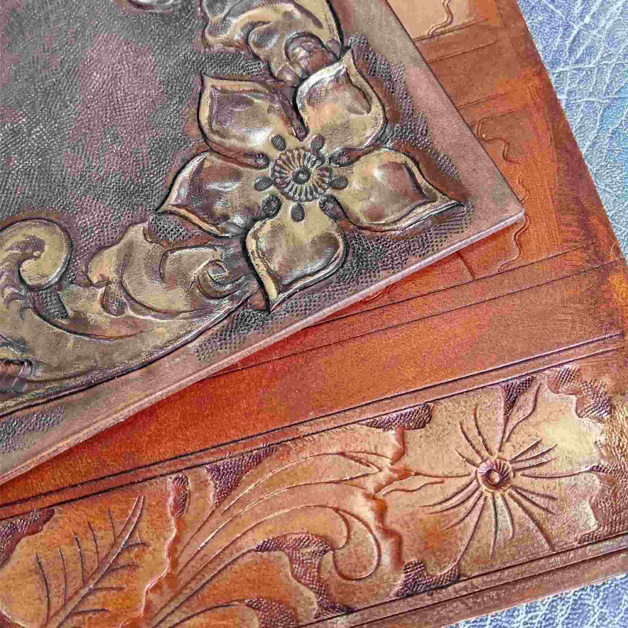 Image to show finger wax gold on embossed and carved leather