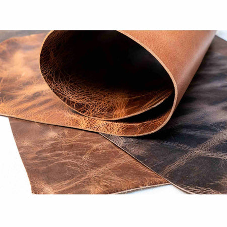 Pull-up heavy weight vintage distressed look leather hides (backs) 3.0-3.5mm  Available in a choice of colours. (See size guide for approximate size dimensions)  Ideal for belt lengths, collars, leads, knife and axe sheaths, satchels and more..