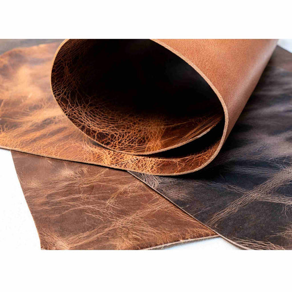 Pull-up heavy weight vintage distressed look leather hides (backs) 3.0-3.5mm  Available in a choice of colours. (See size guide for approximate size dimensions)  Ideal for belt lengths, collars, leads, knife and axe sheaths, satchels and more..