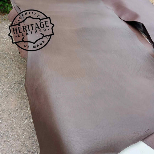 Load image into Gallery viewer, softer mellow type cowhide type leather in butts or short backs. Long lengths, a dark Bourneville Brown in colour.
