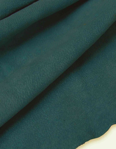 Soft and tactile lightweight suede leather in a muted shade of blue/green teal ideal for garment making, applique, linings