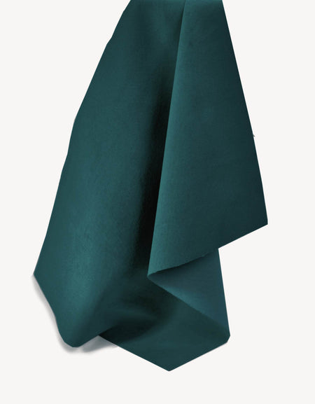 Soft and tactile lightweight suede leather in a muted shade of blue/green teal ideal for garment making, applique, linings