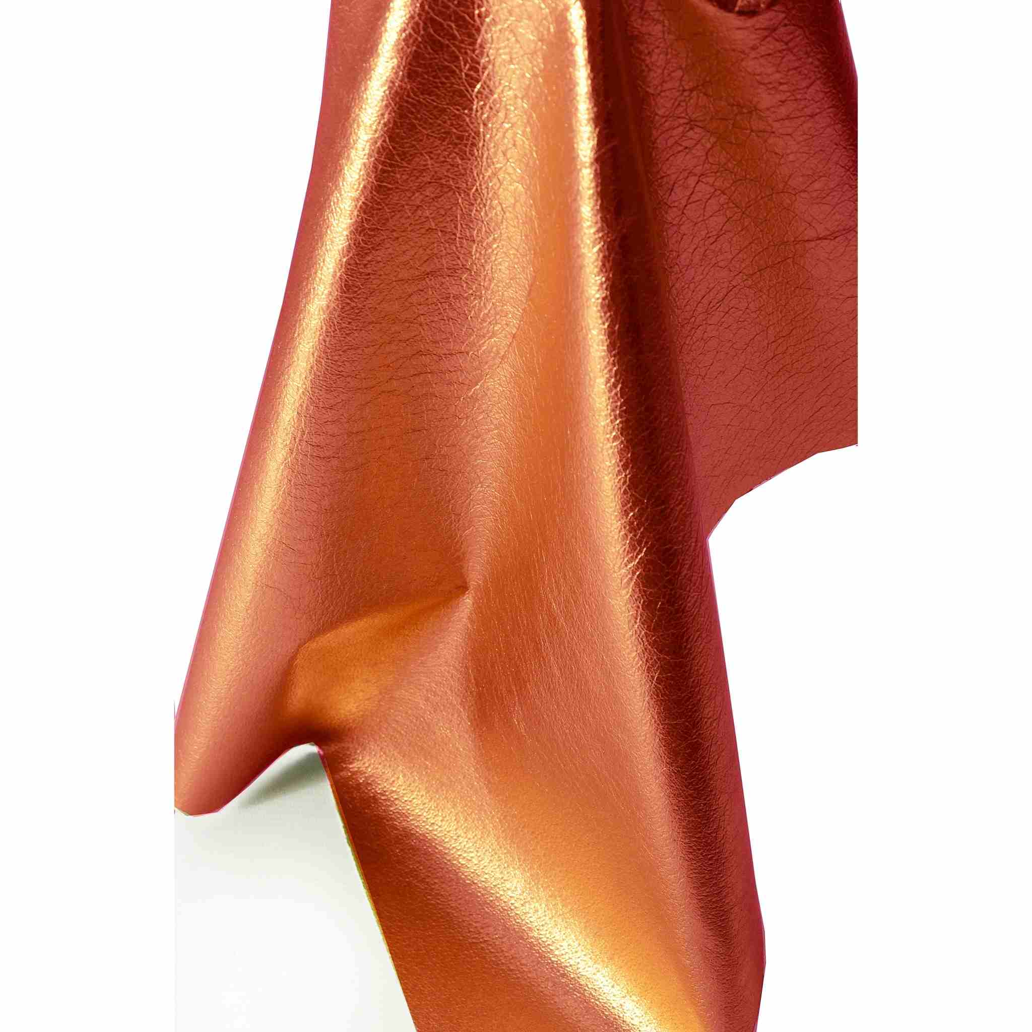 Orange metallic shimmer soft foil leather that can easily be machine sewn for clothing, and craft