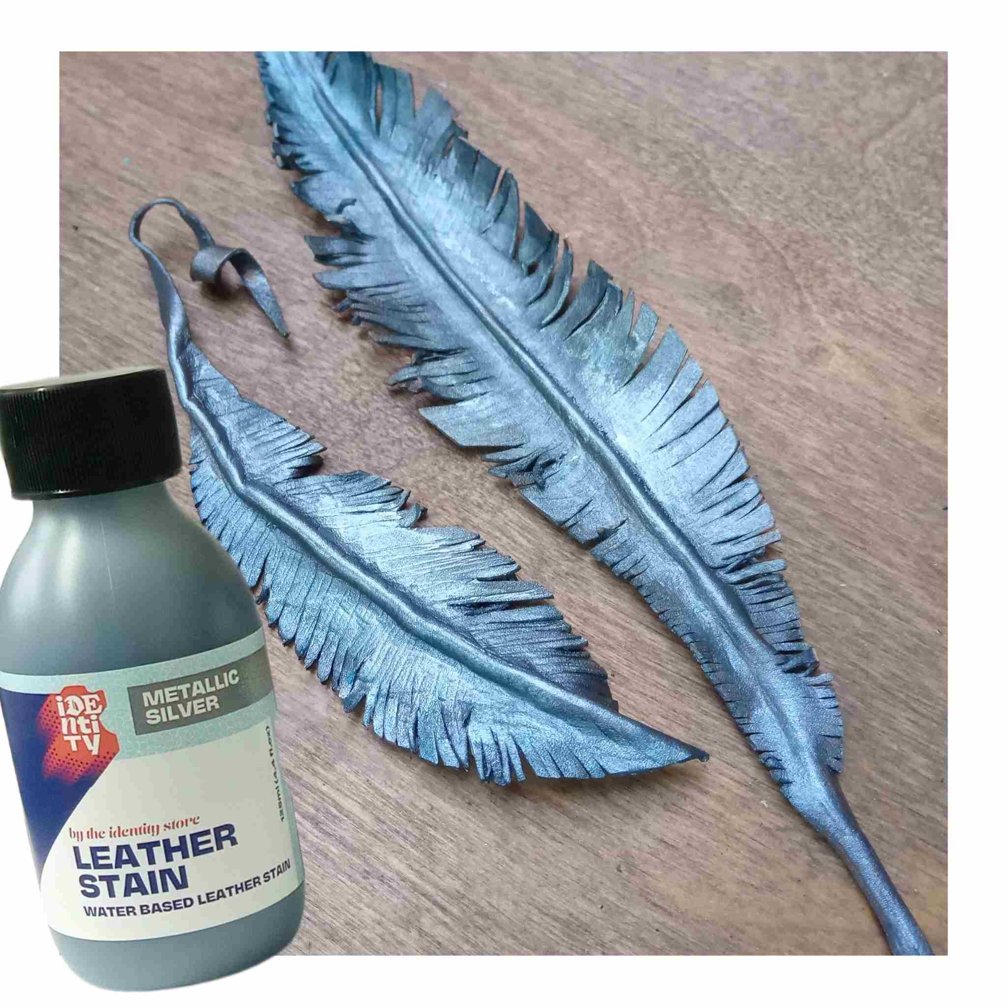 Identity Water Based Leather Stain in Silver used to paint colour a veg tan formed feather for metallic effect