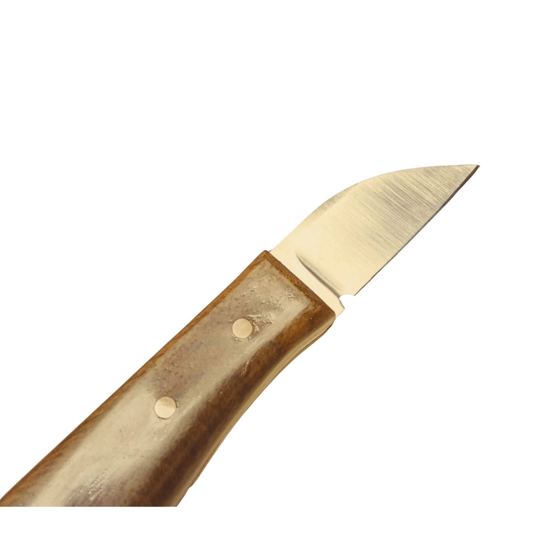 Handmade leathercraft trim knife made by Shing Chan for Identity Leathercraft, D2 steel with sustainably sourced walnut handles and copper rivets.