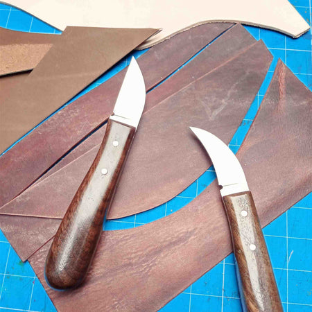 Handmade leathercraft knives made by Shing Chan for Identity Leathercraft, D2 steel with sustainably sourced walnut handles and copper rivets.