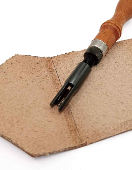 Wood handle adjustable 'u' shaped gouge.  For use with thicker and heavier weights of vegetable tanned leather this hand tool is ideal for gouging out deep channels to make room for the leather to fold over and in eg making boxes/cases from leather, or setting creases and folds in satchels and bag making.