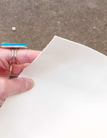 Cut piece of lovely creamy white eco sourced leather for craft