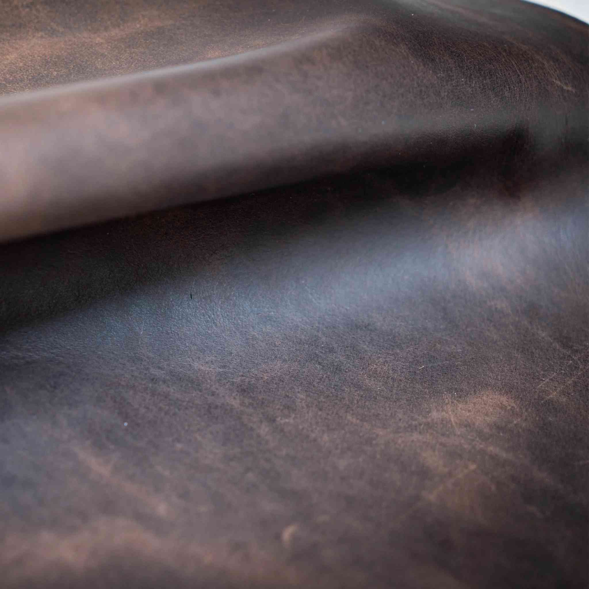 New in Stock  Soft, vintage look cowhide, approx 1.0-1.4mm in Dark Brown  Ideal for upholstery, bag making, waistcoats, jackets, tool rolls, aprons, pouches, Dopp zipped travel bags and more.