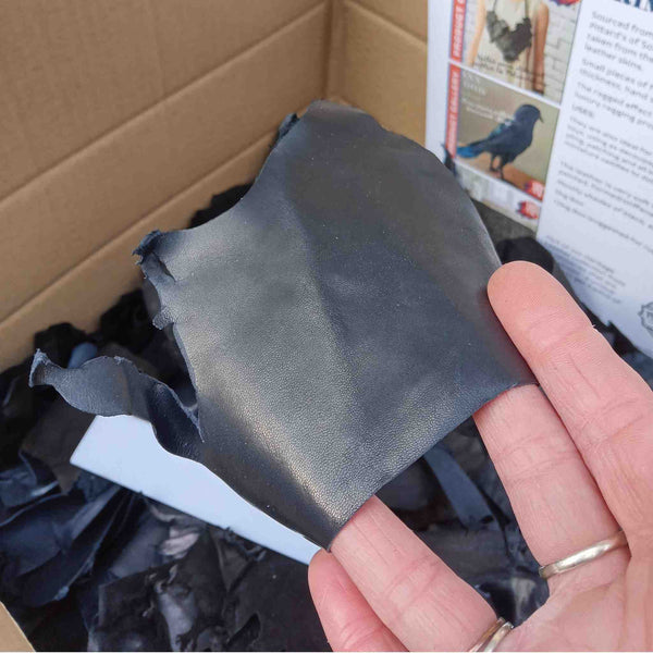 Close up to show midnight blue piece of gloving leather from the trimmings box