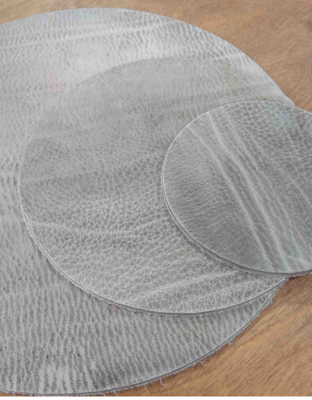 Pre-cut circles - This leather has been made to stay extremely firm. It is a mineral based simple tannage with a large amount of wax impregnated to give it a solid but natural feel, without compromising on the beauty of the leather grain.
