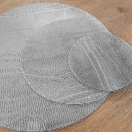 Pre-cut circles - This leather has been made to stay extremely firm. It is a mineral based simple tannage with a large amount of wax impregnated to give it a solid but natural feel, without compromising on the beauty of the leather grain.