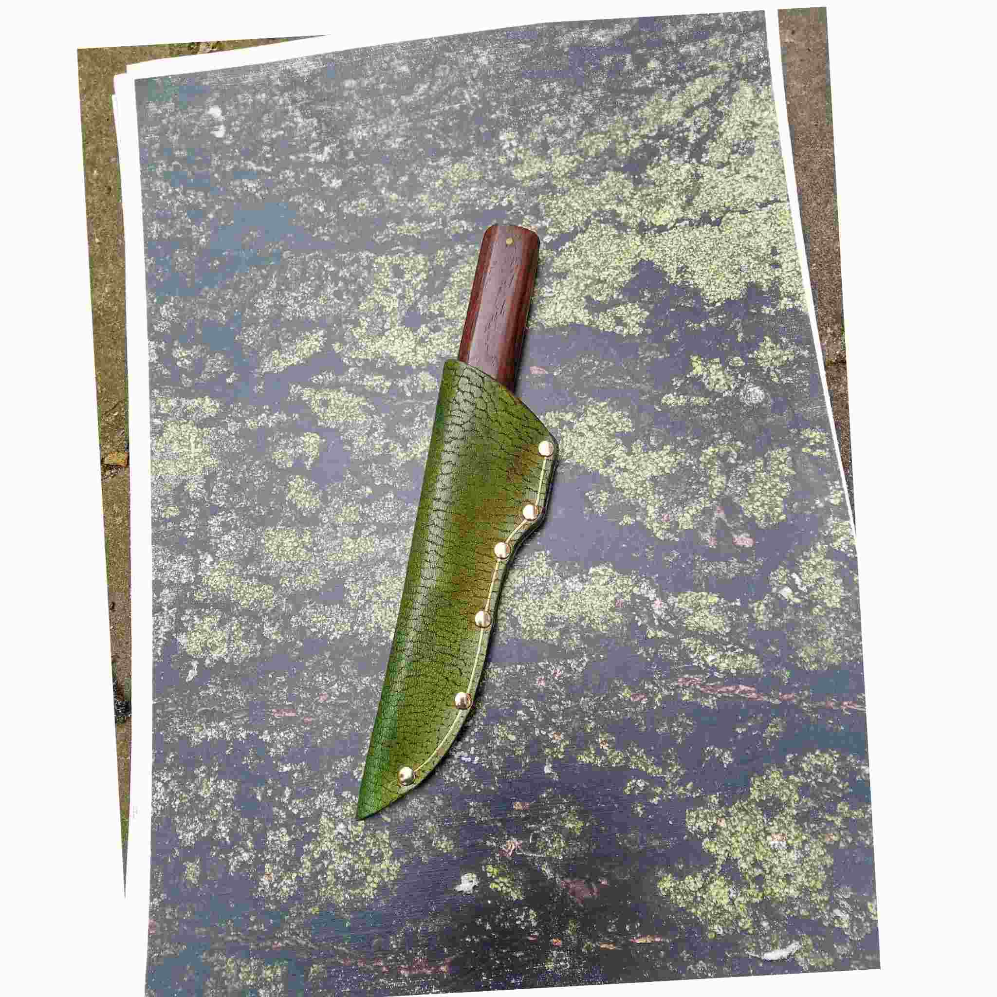 Leather Knife sheath photographed on a moss printed leather backdrop from Identity printed craft A3 leather selection