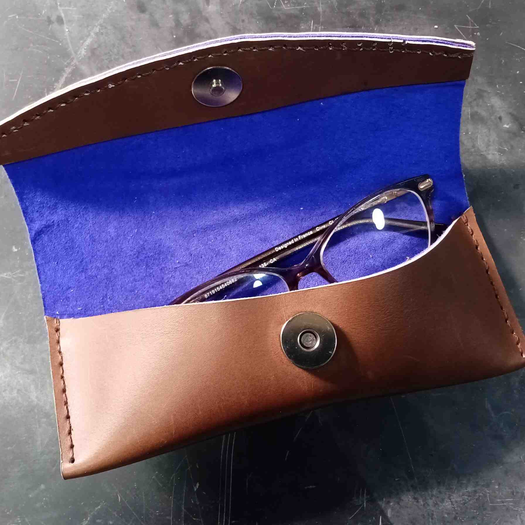 Finished leather glasses case made using the acrylic template