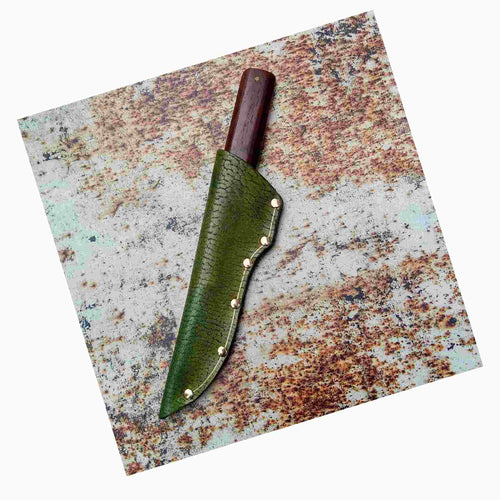 Load image into Gallery viewer, Leather knife sheath product photographed on to a rust backdrop leather print A3
