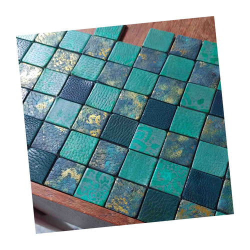 Load image into Gallery viewer, Planning out a leather tile mosaic for a table top, tiles painted, dyed and foiled
