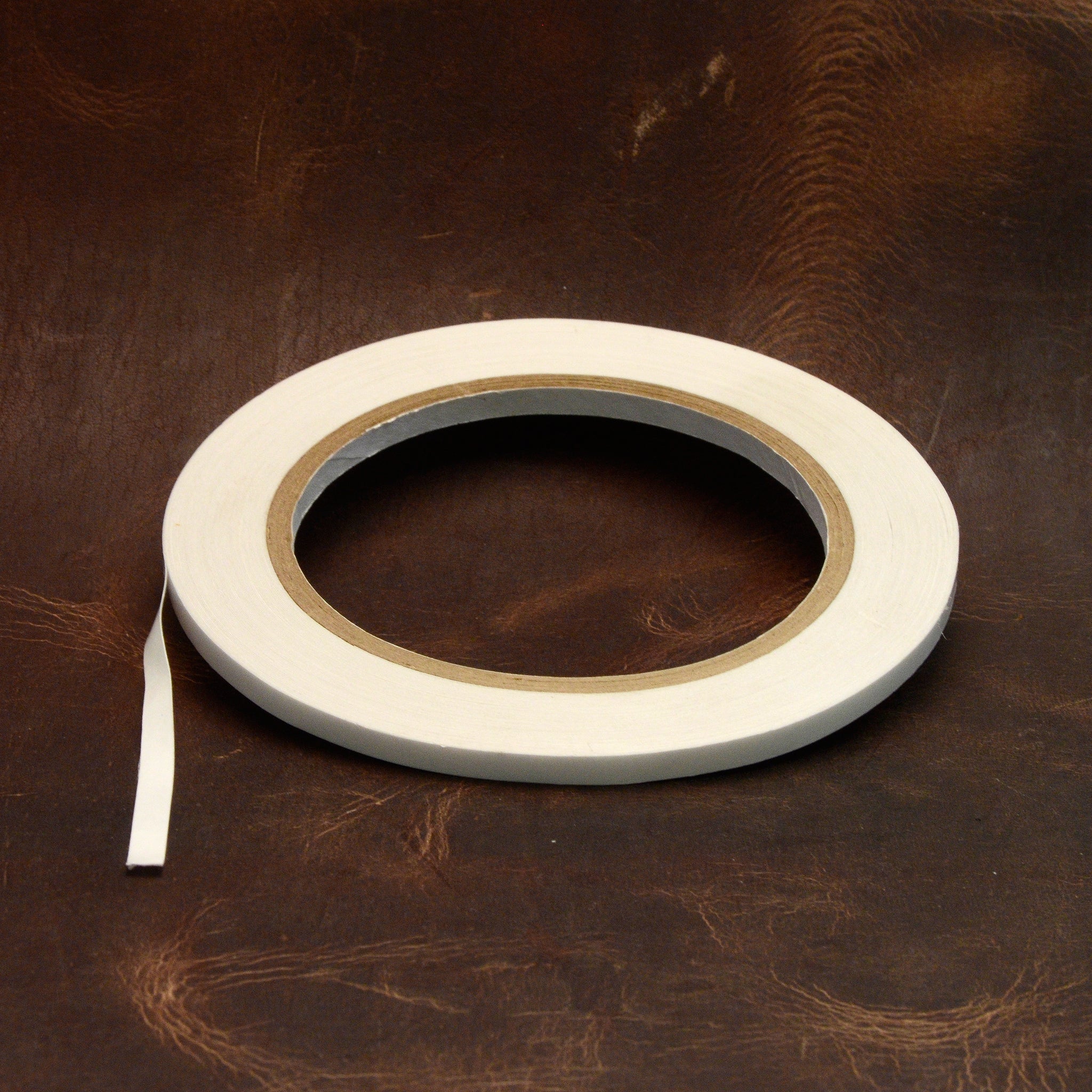 Permanent double sided thin tape ideal for leathercraft to hold while stitching