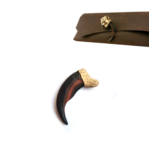 Reproduction resin bear claw in two sizes - Measuring from top to tip - Small 51mm (2"), Large 89mm (3 1/2")  Made from solid hard cast resin with a very real appearance these bear claws can be decoratively for Native American Heritage projects, for general craft for example use for jewellery or as a fastener for a book journal or pouch. They can be easily drilled to place the preferred size and position of the hole.