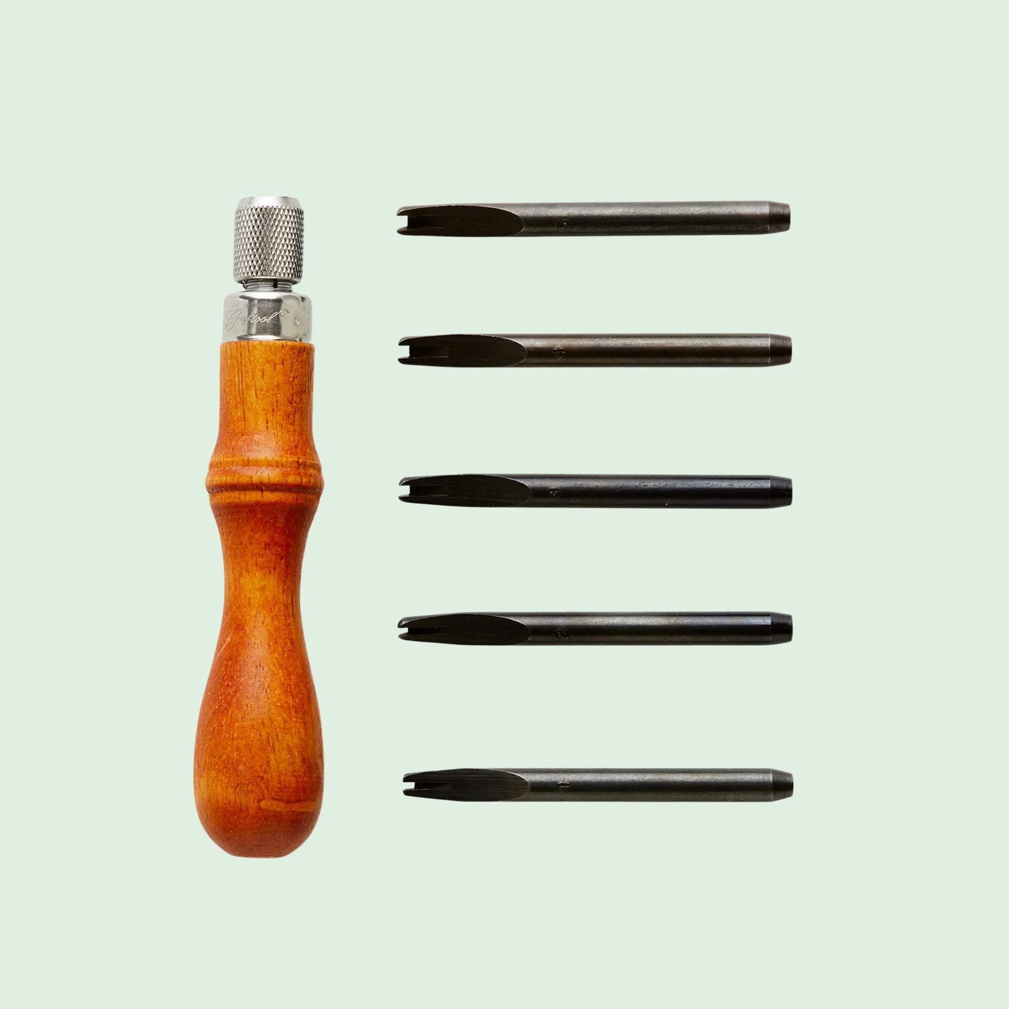 Handle with five edge beveller blades for rounding off vegetable tanned leather edges prior to slicking.  Bevels and rounds edges on a variety of leather projects. The larger the size, the more leather removed. Compatible with a range of leather weights and thickness.