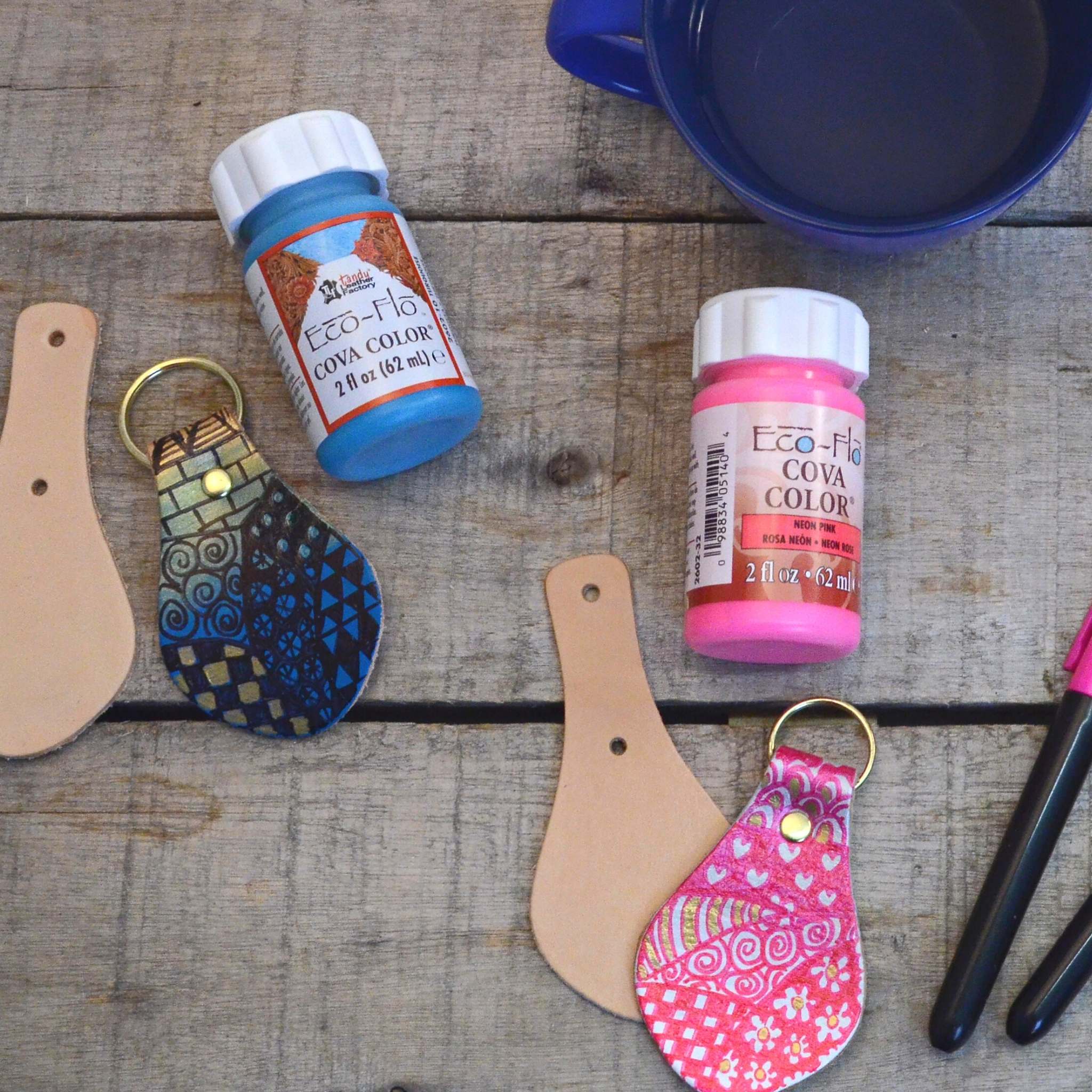 Decorating leather keyrings with paint and pens